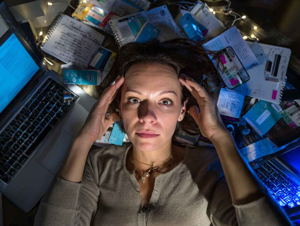 a stressed female spa owner surrounded by clutter 06603890 6f3a 400a b666 91720336e9e6 1