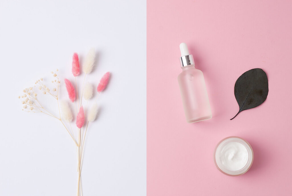 cosmetic product display with flowers on white bac 2026 03 18 04 20 33 utc